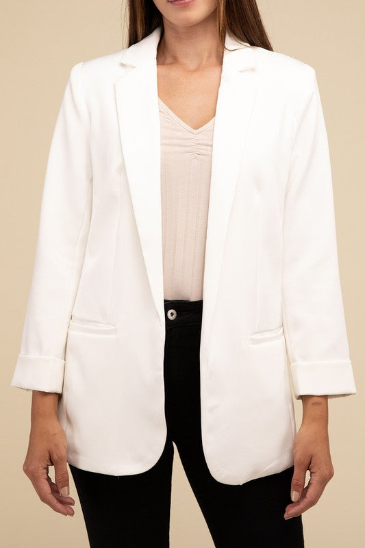 Ivory woven blazer with a lapel neckline, long sleeves, and an open-front design. Features front pockets and a regular fit.