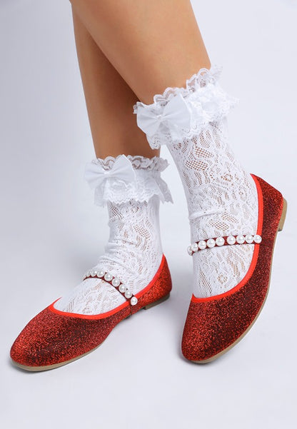 Top front view of red Corphee Pearl Strapped Glitter Ballerinas being worn with pearl strap detail.