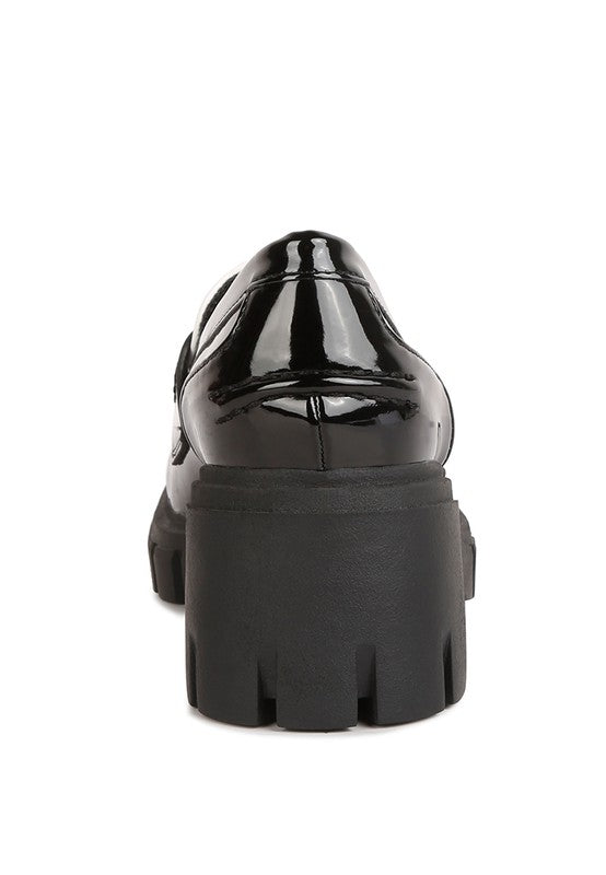Back view of Jonah Platform Loafers in black with block heel construction