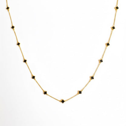 Petite Colored Clover Necklace in black, perfect for layering.
