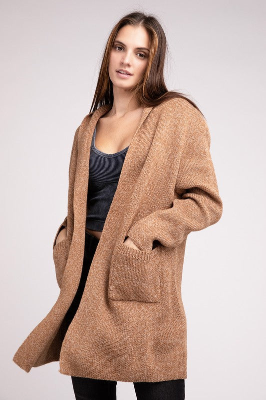 Deep camel sweater cardigan with long sleeves, front pockets, and a hooded neckline. 