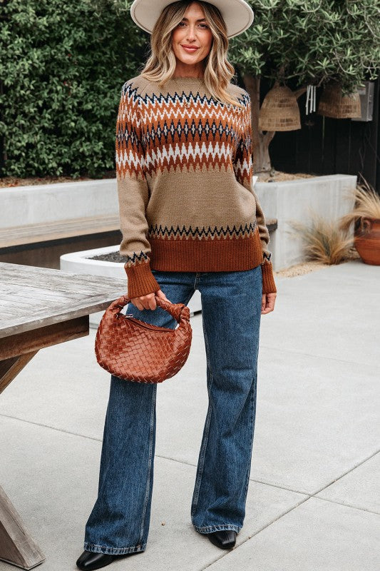 Full body shot of model styled in Eva Aztec Crew Neck Sweater with jeans.
