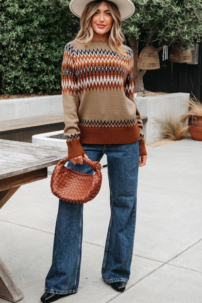 Full body shot of model styled in Eva Aztec Crew Neck Sweater with jeans.