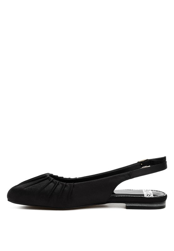 Black satin slingback shoes with square toe, adjustable buckle strap, flat heel, and plush cushion insole.