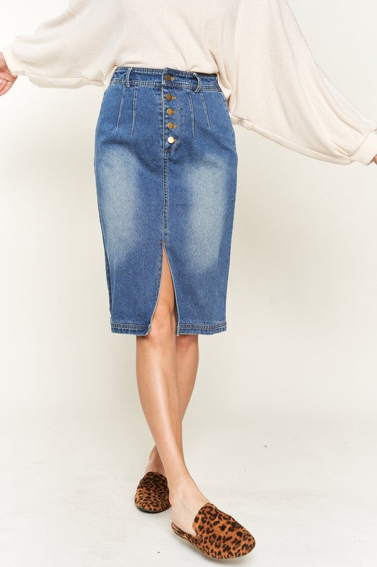 Denim button-down midi skirt with a front slit, belt loops, and back pockets. Features a high waist with an elasticized waistband in the back.