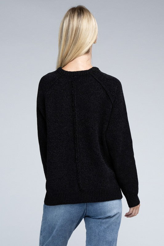 Black round neck chenille sweater with long raglan sleeves, relaxed fit, and hip-length cut.