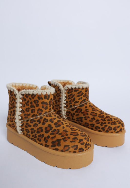 Front angle of Rochas Leopard Snow Boots with bold print, scalloped trim, and chunky flatform sole.