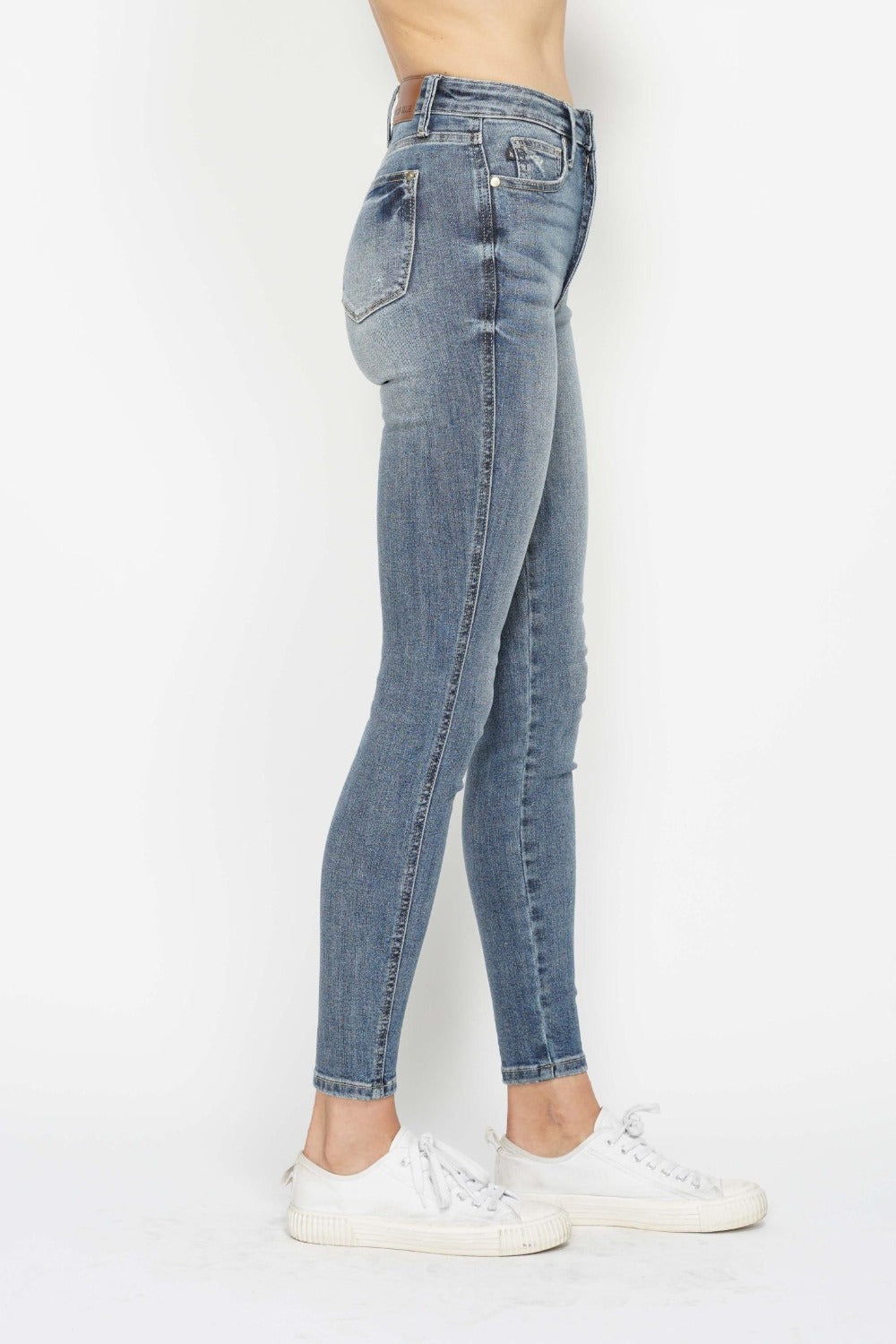 Tummy Control Contrast Wash Skinny Jeans by Judy Blue in medium wash. High waist with tummy control panel, skinny leg silhouette, and moderate stretch for comfort and style. Versatile and flattering