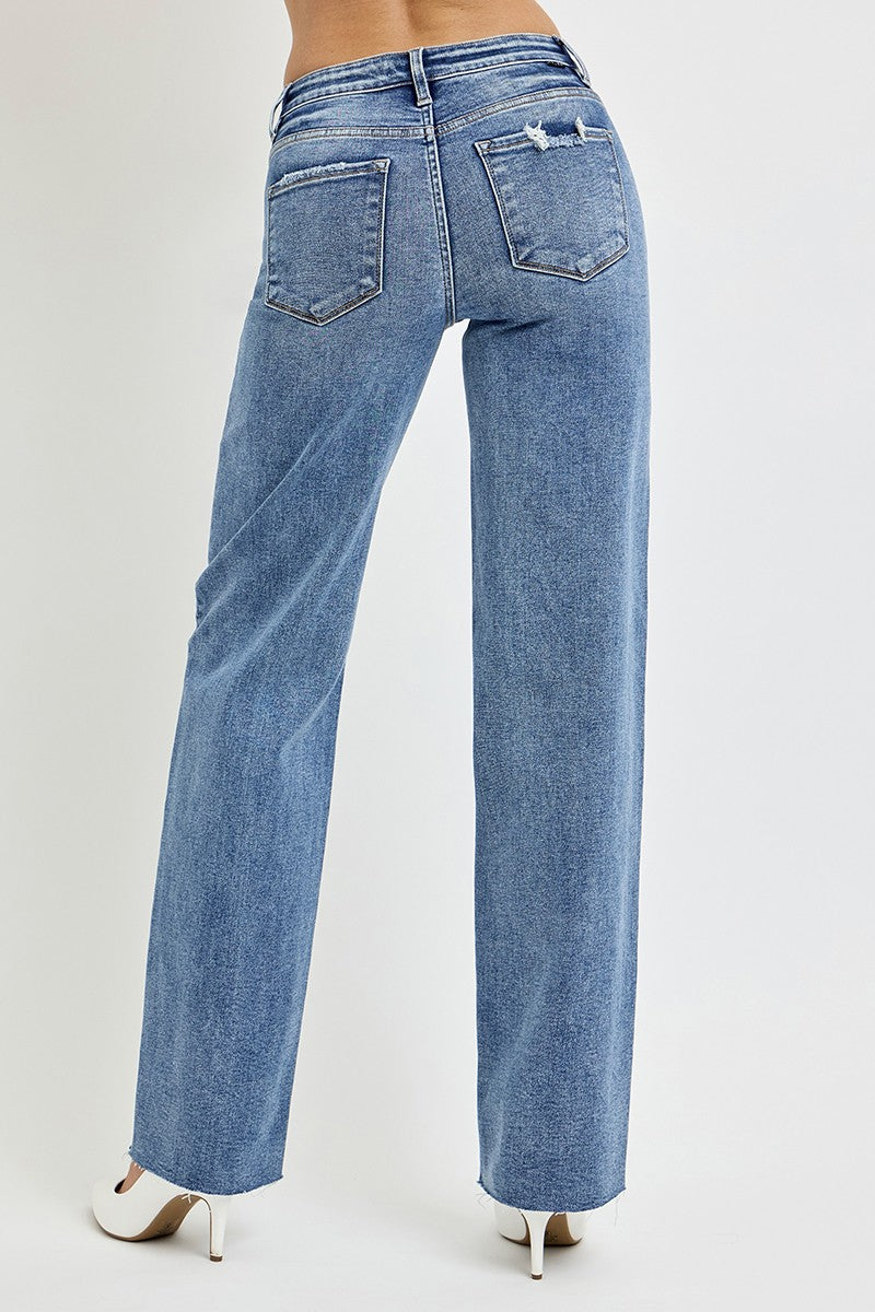 Risen Dana High Rise Straight Leg Jeans in medium wash, featuring a flattering high-waisted fit, slightly stretchy fabric, raw hem, and versatile straight-leg silhouette.