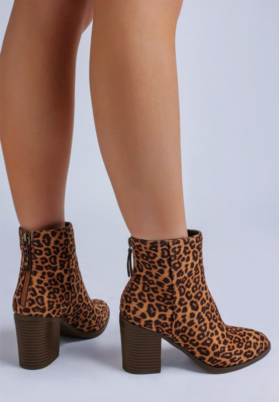 Back view of Lunara Leopard Print Boots with paneling and stacked heel