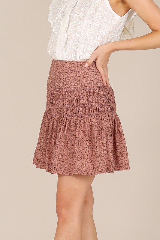 Brown floral smocked skirt with pleats, side zipper, and lining for coverage.