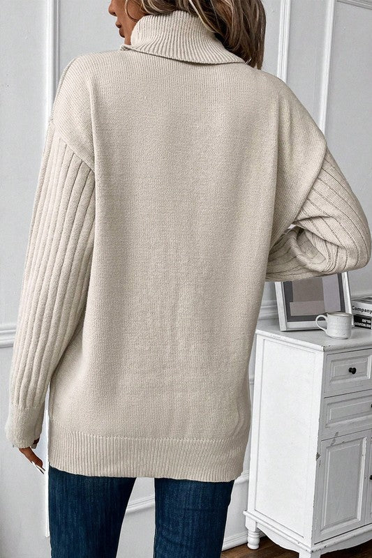 Fable Turtleneck Pullover Sweater back view in taupe with long sleeves.