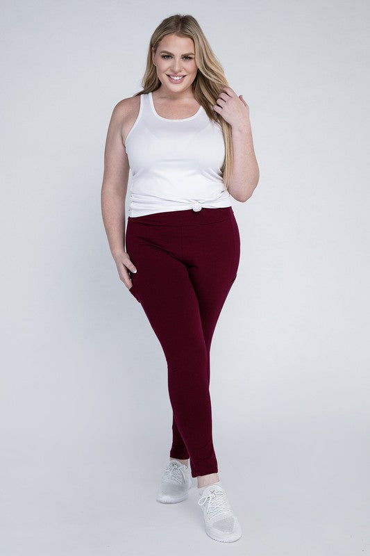 Full-length curvy plus leggings in dark burgandy with a high-rise thick waistband, fitted silhouette, and convenient leg pockets.