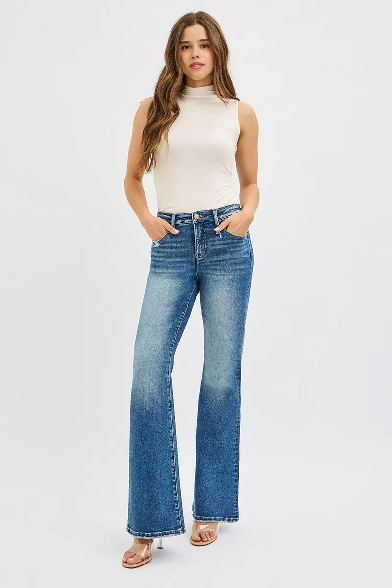 Full body shot of Jordy Tummy Control High Rise Flare Jeans styled with a fitted blouse.