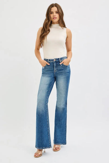 Full body shot of Jordy Tummy Control High Rise Flare Jeans styled with a fitted blouse.