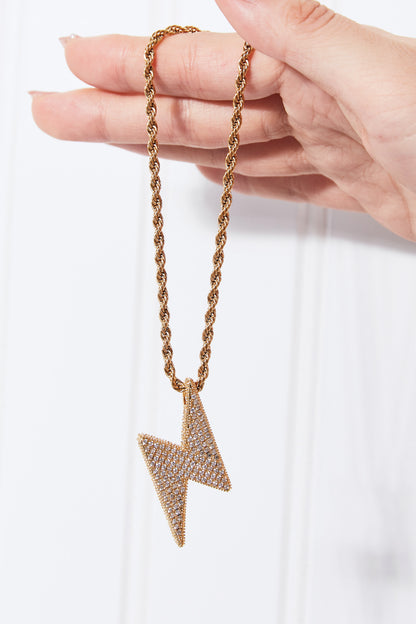 Lightning pendant necklace with a twisted chain, crafted from brass, stainless steel, and cubic zirconia for a sparkling touch.