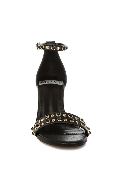 Black genuine leather studded wedge sandals front view.
