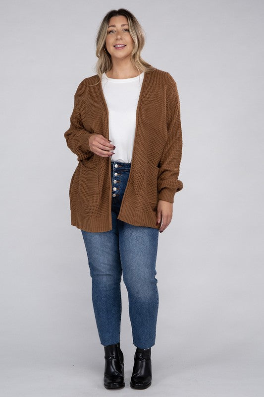 Curvy plus-size waffle-pattern open cardigan sweater in deep camel, with long sleeves, oversized fit, and pockets.