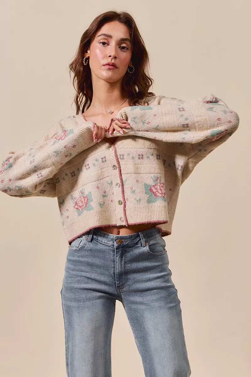 Lifestyle photo of Sonny Floral Beige Cardigan – front view, button V-neck knit with pink teal flowers.