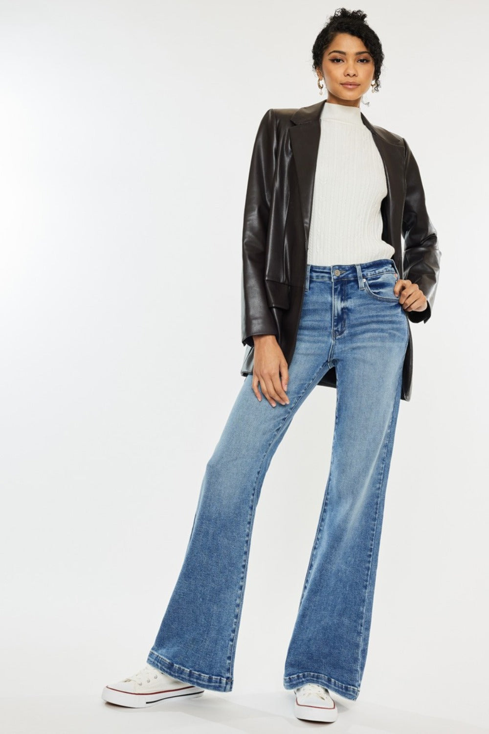 High Rise Wide Leg Jeans in medium wash by Kancan. Slightly stretchy denim with classic 5-pocket design, regular hem, and zipper fly. Versatile wide-leg flare silhouette.