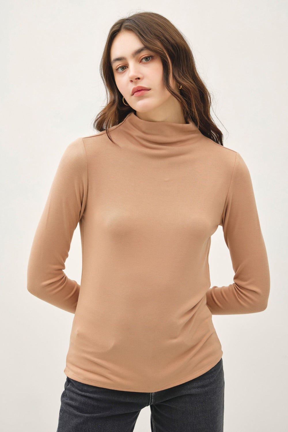 Camel mock neck long sleeve t-shirt in soft, stretchy fabric.