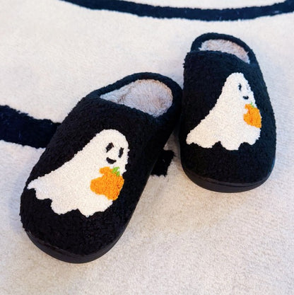 Front view of Spooky Ghost Cozy Slippers showing soft plush upper and Halloween ghost pattern.