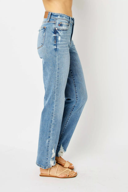 Side angle Judy Blue Estee jeans, medium wash straight leg with distressed ankles and high waist fit.