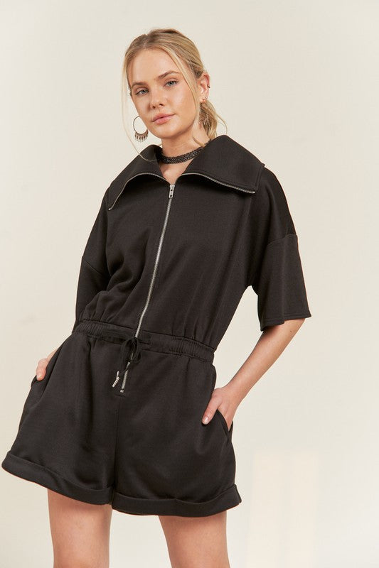 Black Clover Plus Size romper with half-zip neckline and elastic drawstring waist.