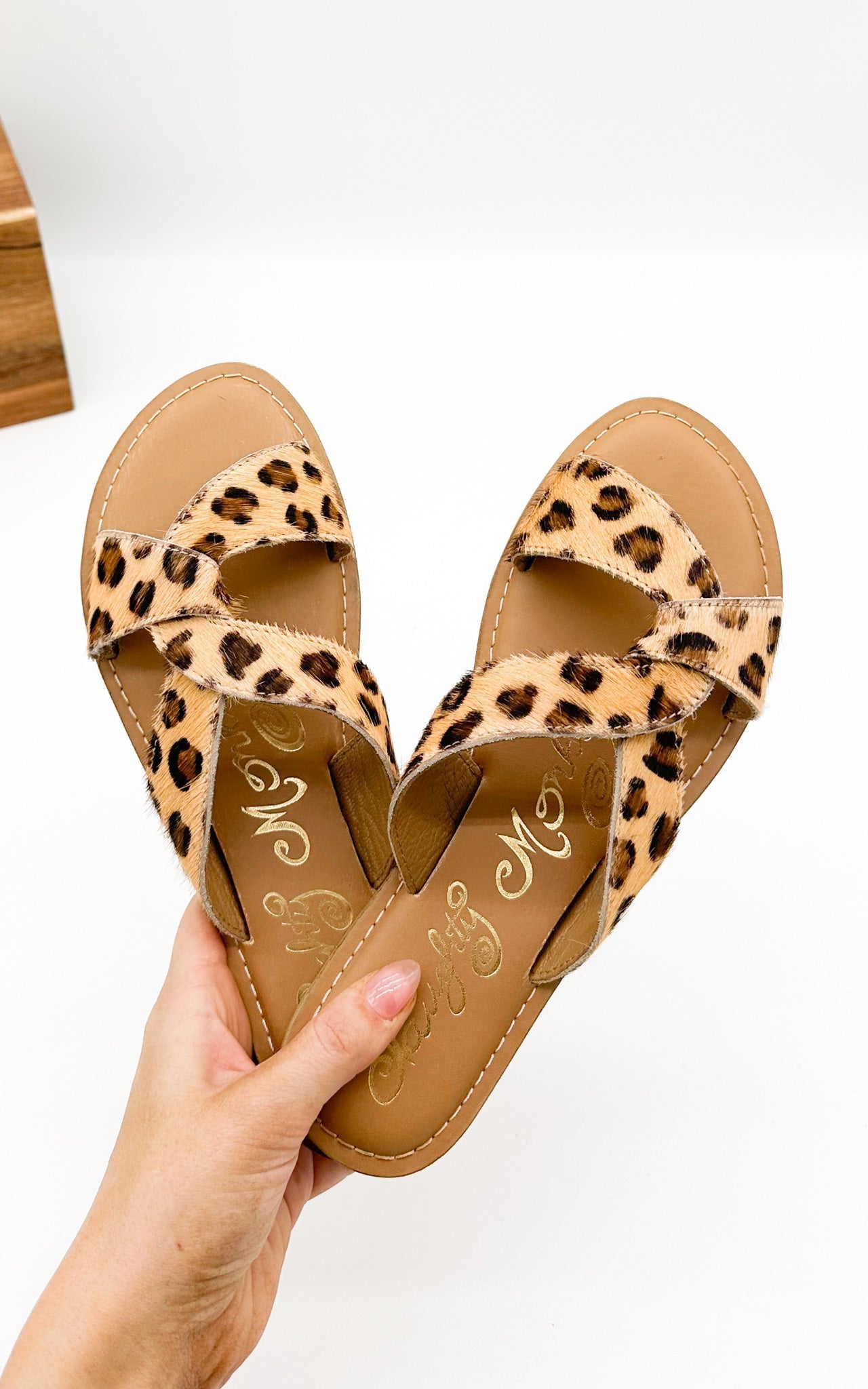 Flat leopard sandals with open toe and knotted strap—Naughty Monkey Conga sandal in genuine leather.
