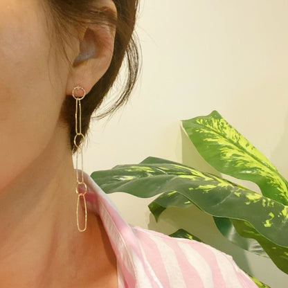 Model wearing Dainty Chain Link Drop Earrings with chic elongated style