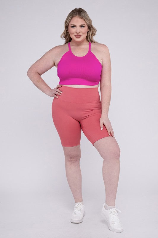 High-rise plus-size athletic biker shorts in desert rose, featuring a fitted silhouette and seamless design for comfort and flexibility.