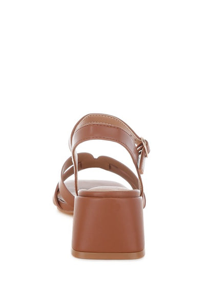 Back view of tan Eliska Strappy Block Heels showing stacked heel and strap.