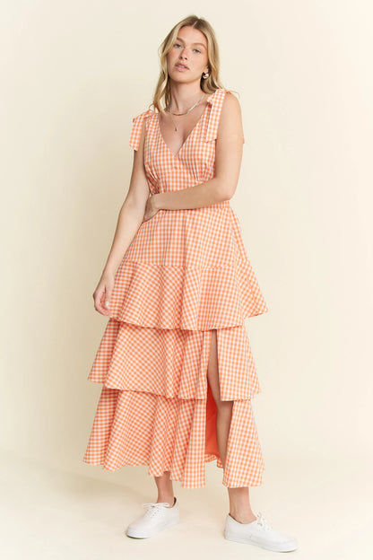 Front view of Alice Gingham Tiered Midi Dress by Jade by Jane, showing green and white gingham print, V-neckline, and ruffled tiered skirt with slit.