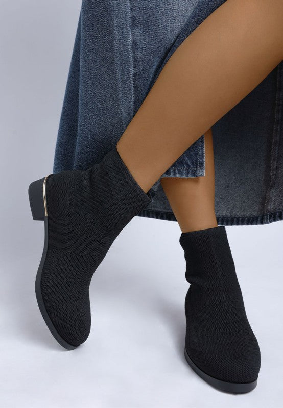 Front view of black Rosamund Boots showing closed round toe and seamless knit.