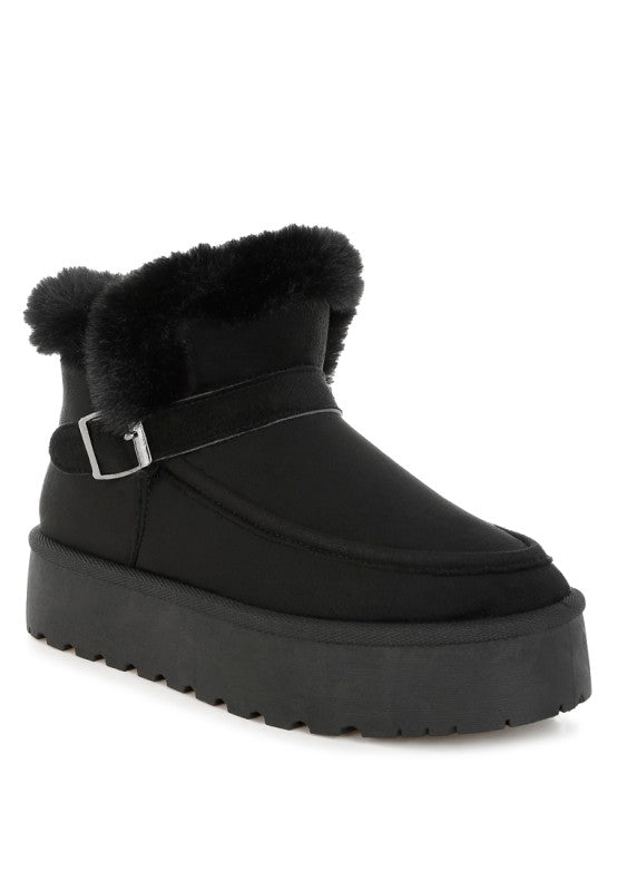 Black Linka Snow Boots with faux fur collar and gold-tone pin buckle strap detail.