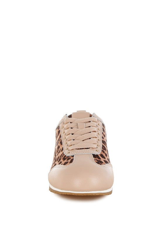 Leopard print and beige leather sneakers front view with stud embellishments, lace-up closure, and flatform sole.