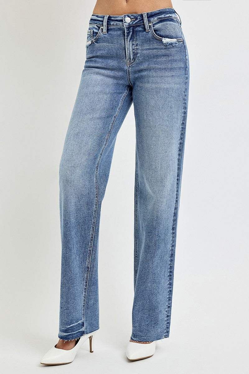 Risen Dana High Rise Straight Leg Jeans in medium wash, featuring a flattering high-waisted fit, slightly stretchy fabric, raw hem, and versatile straight-leg silhouette.