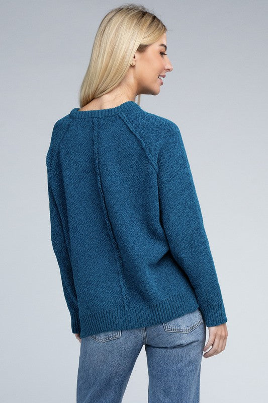 Ocean teal round neck chenille sweater with long raglan sleeves, relaxed fit, and hip-length cut.