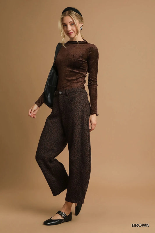 Full body shot of model wearing Finley leopard print wide leg pants with flowy fit and pockets.