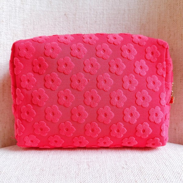 Pink Embossed Daisy Blossom Cosmetic Case with floral pattern and daisy zipper pull.