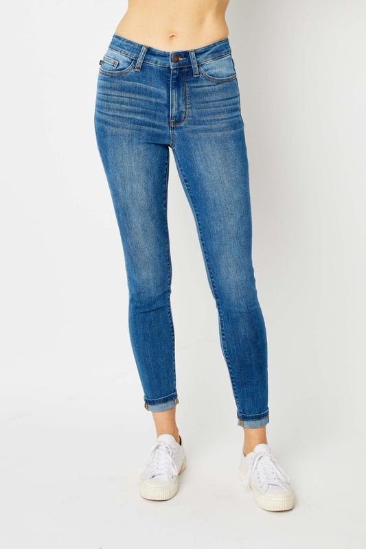 Mid-rise skinny jeans with cuffed hems and a zip fly. Medium wash with a slim fit and highly stretchy fabric.