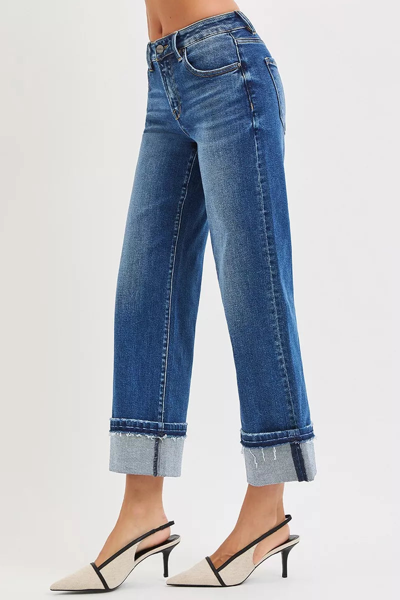 Side angle of Vera Mid Rise Straight Jeans featuring cuffed raw hem.