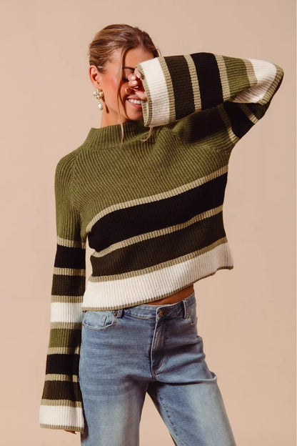 Front angle showing colorful stripes on olive multi mock neck sweater.