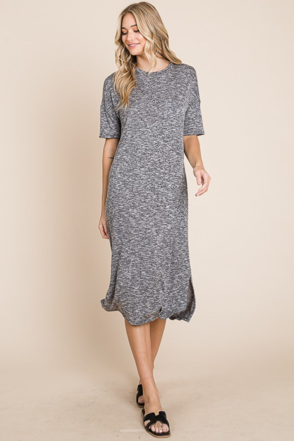 Grey midi dress with a round neck, half sleeves, and a slit detail.