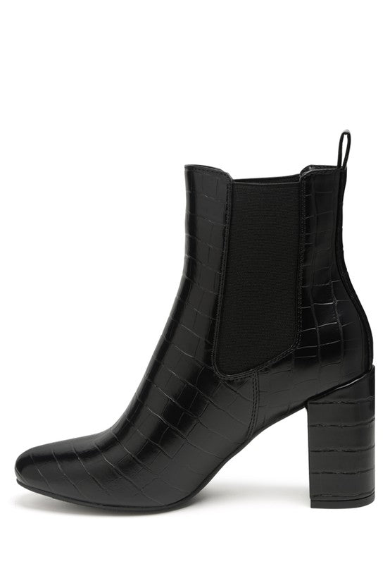 Side angle top view of black Briony Patent Block Heel Ankle Boots showing elastic gusset and heel.