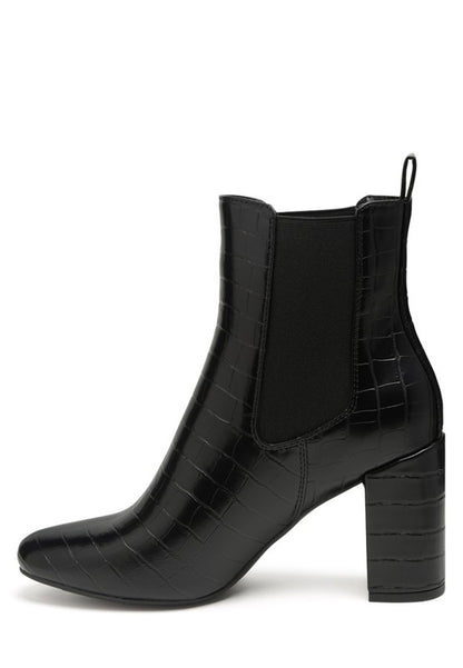 Side angle top view of black Briony Patent Block Heel Ankle Boots showing elastic gusset and heel.