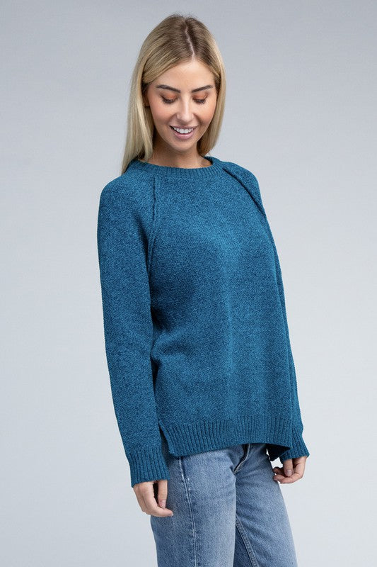 Ocean teal round neck chenille sweater with long raglan sleeves, relaxed fit, and hip-length cut.