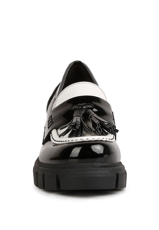 Front view of Jonah Platform Loafers in black and white with rounded toe design
