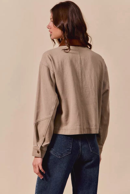 Back view of Suri Cotton Twill Cropped Barn Jacket showing structured seams and relaxed fit.