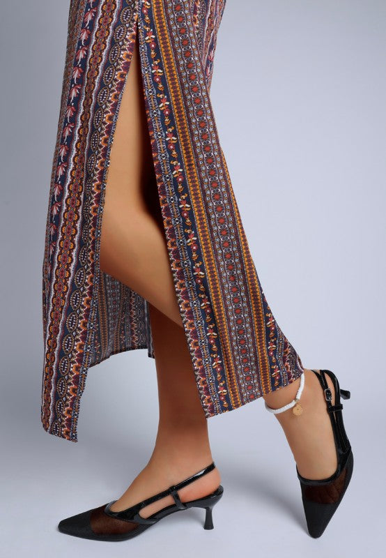 Model walking in Florina Mesh Slingback Heels styled with boho dress and white anklet
